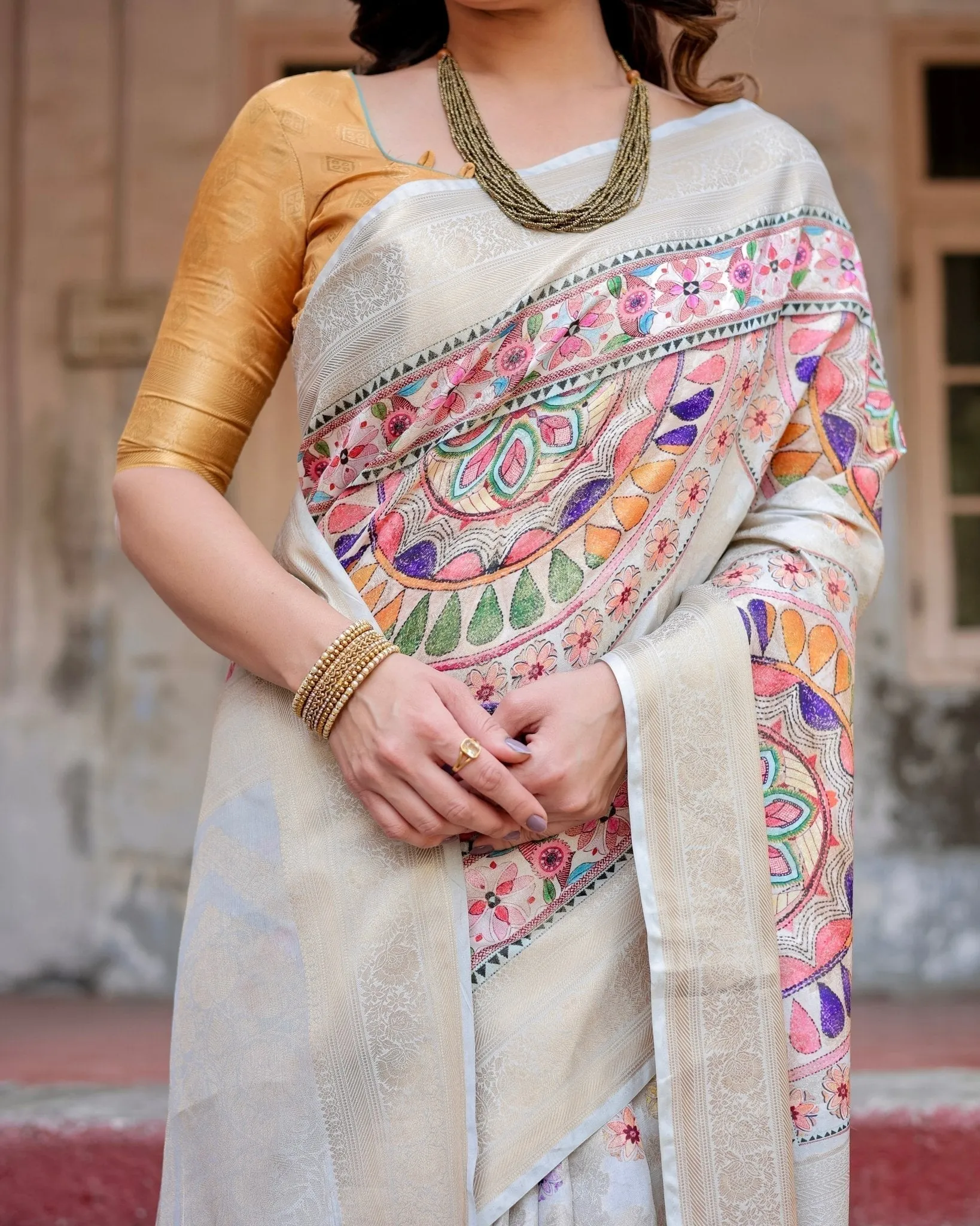 Off-White and Multicolor Mandala Design Banarasi Silk Saree with Zari Weave and Tassel-Adorned Pallu