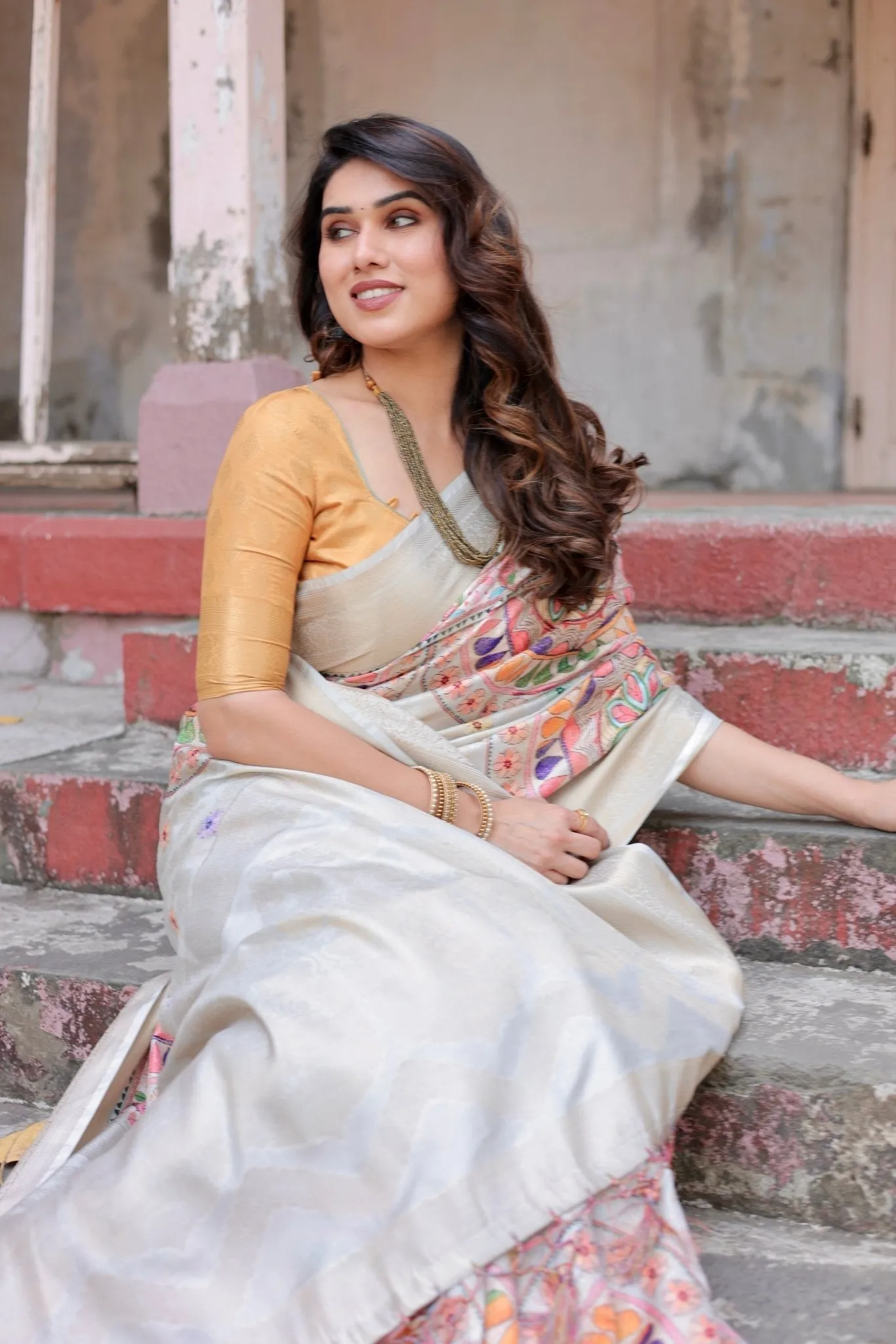 Off-White and Multicolor Mandala Design Banarasi Silk Saree with Zari Weave and Tassel-Adorned Pallu